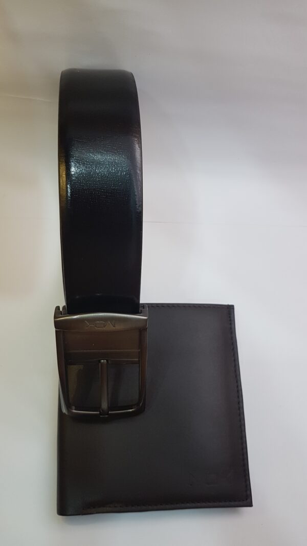 A premium black leather belt with a metal buckle, displayed alongside a matching black wallet.